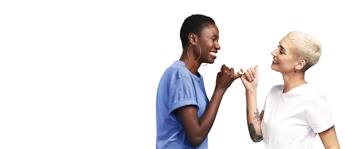 two friends are holding their pinkie fingers together and smiling